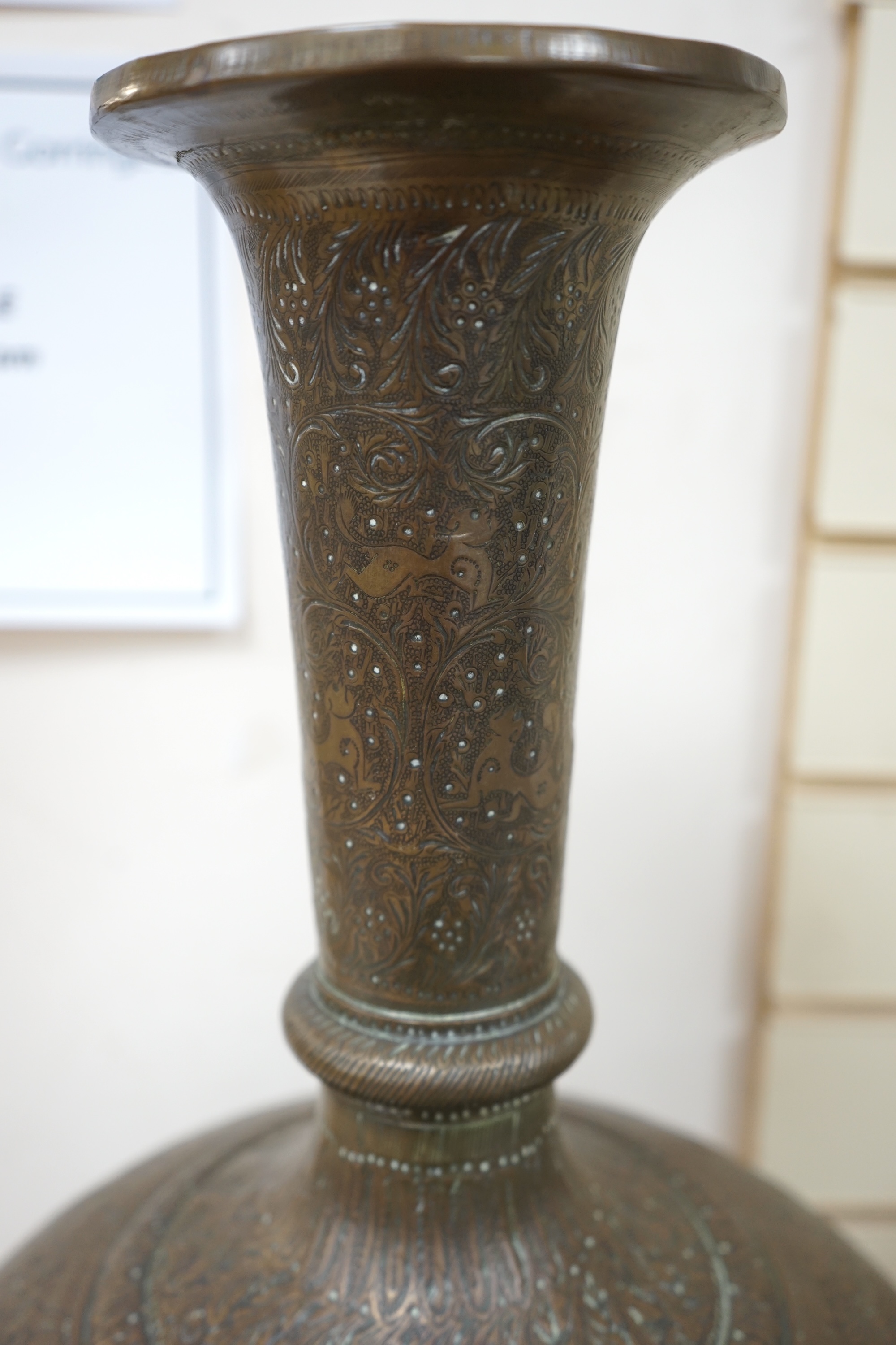 A large Indian repoussé work brass vase, 62cm high. Condition - good